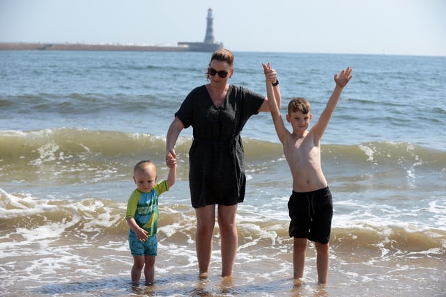 Youngsters Jake, two and Theo, seven, with mother Jennifer Fowler, cool off at Roker Harbour Beach during the hot weather.