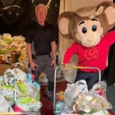 Gully Mouse and David Knott from New Hope Foodbank with the haul of food donations from Gulliver’s Valley. The theme park resort held a Foodbank Weekend, asking visitors to bring donations of food