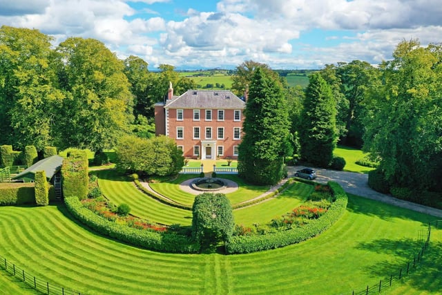 The property boasts formal gardens and landscaped grounds