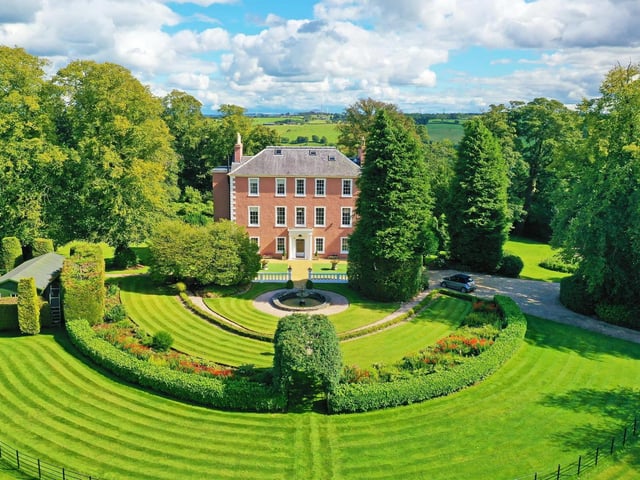 The property boasts formal gardens and landscaped grounds
