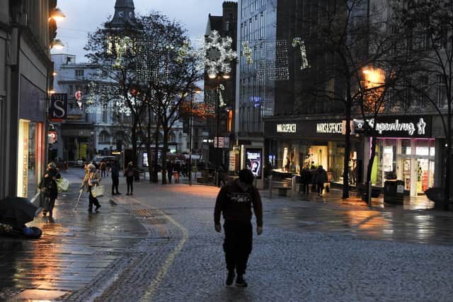A few shoppers around in Sheffield city centre as the Christmas lights are turned on.