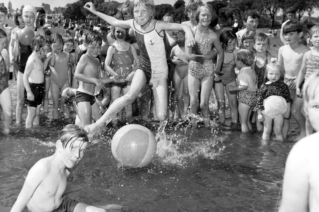 Children enjoy the paddling pool at St Margaret's Loch as temperatures soared to 77 degrees in July 1966.