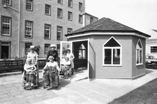 Nurses and patients at Queensberry House hospital in Edinburgh, May 1983. The summer house.