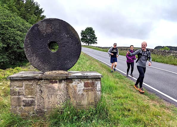 Mike and supporters at a Peak District boundary marker