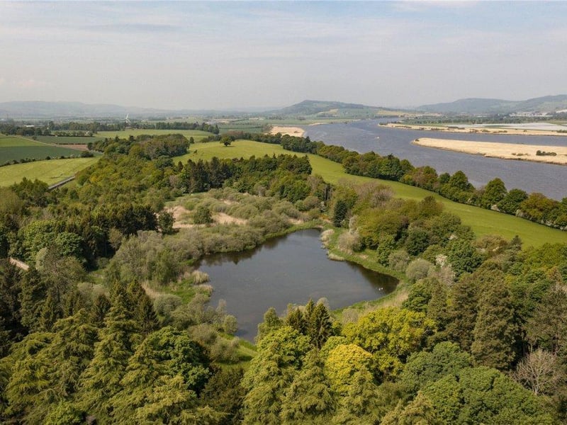 Aerial view of grounds, including pond.