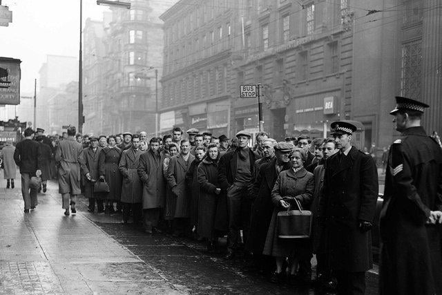 Football fans queue in Glasgow for Tickets to Celtic v Rangers - New Years Day Match in 1965.