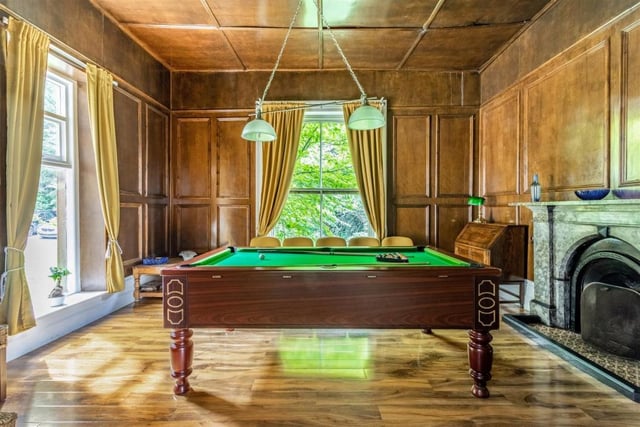 A real throwback to Victorian times is this wonderful billiards room, with its wooden wall-panelling, wood flooring, large sash windows and ornate fireplace. Perfect for after-dinner entertainment.