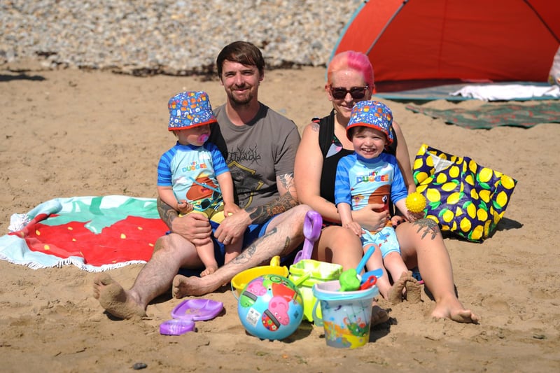 Joe and Bianca Dawson with children Issac and Eli down on the beach.