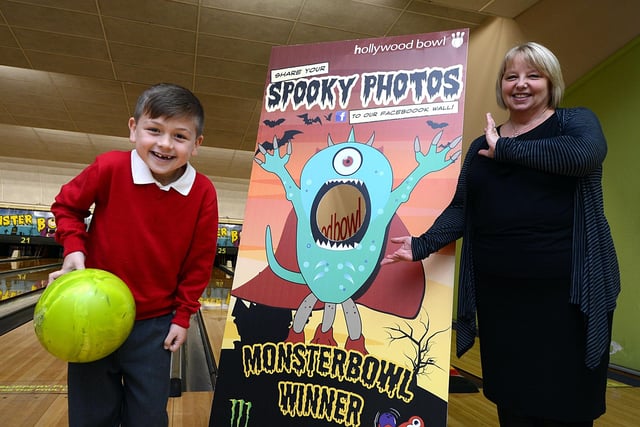 Seven-year-old Alex Mendoza, of Rawmarsh, won a game of bowling for his whole class at the Hollywood Bowl, Valley Centertainment after designing a monster for Halloween. Our picture shows Alex with his design, which has now been made into a full-size cutout and is on display at Hollywood Bowls across the country. Looking on is Bowl manager Bev O'Connor