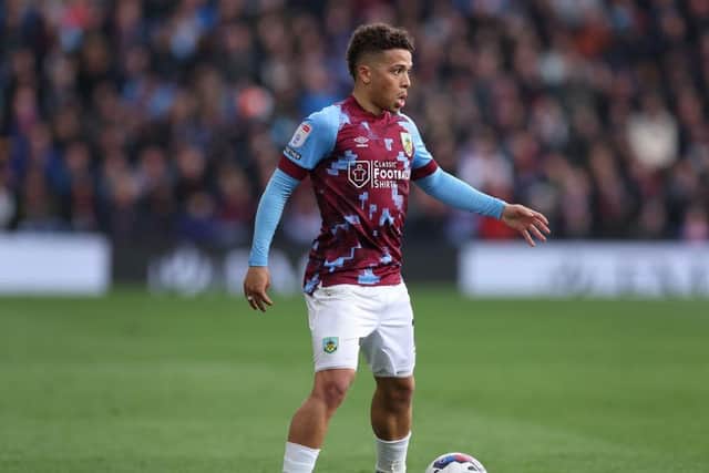 BURNLEY, ENGLAND - APRIL 22: Manuel Benson of Burnley runs with the ball during the Sky Bet Championship between Burnley and Queens Park Rangers at Turf Moor on April 22, 2023 in Burnley, England. (Photo by Alex Livesey/Getty Images)