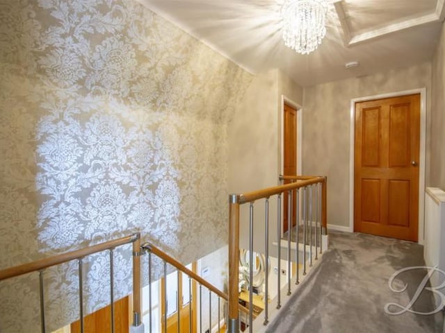 Featuring a modern bannister.