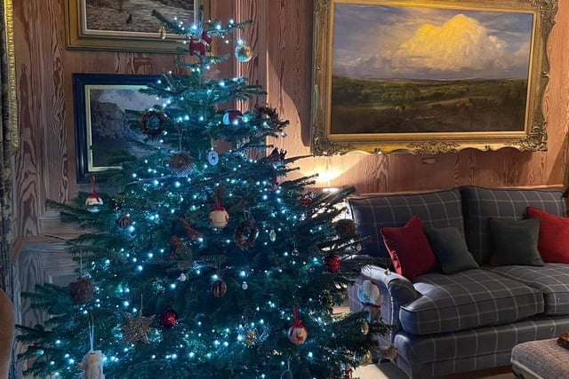 The tree at hotel Links House at Royal Dornoch has lights in a lovely blue colour that echoes the sea in their landscape painting. 
Golf Road, Dornoch, www.linkshousedornoch.com