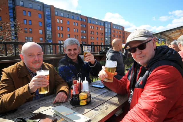 The reopening of pubs on April 12th 2021. The Riverside Kelham. Sheffield. Pictured are Andrew Hobson, Jim Rylatt, and Dill Young. Picture: Chris Etchells
