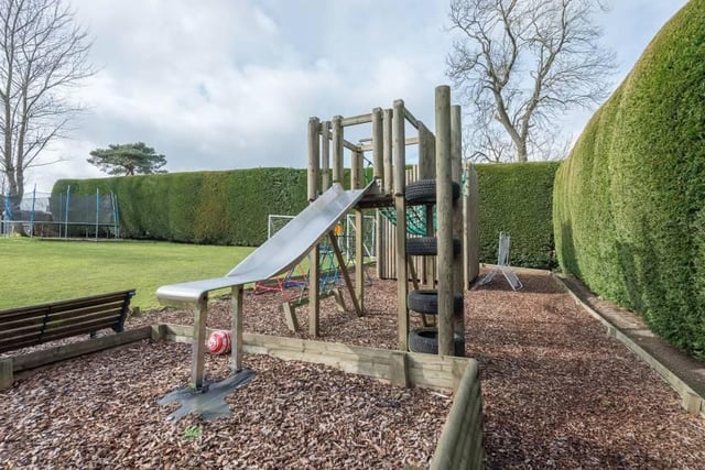 Offering privacy and seclusion with automatic gates, Hartside House includes "a large enclosed lawn garden with solid wood children’s play area and roped walkway surrounded and secured by a feature 15 foot mature hedge".