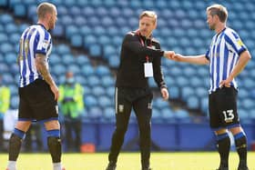 Owls Manager Garry Monk with Connor Wickham and Julian Borner on Saturday. Pic: Steve Ellis.
