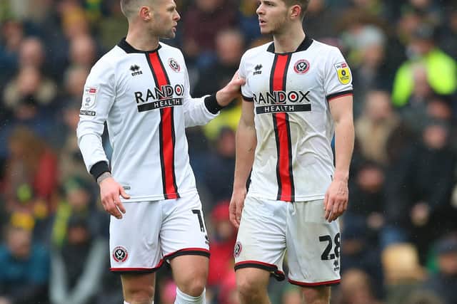 Oliver Norwood of Sheffield United gives James McAtee some advice: Simon Bellis / Sportimage