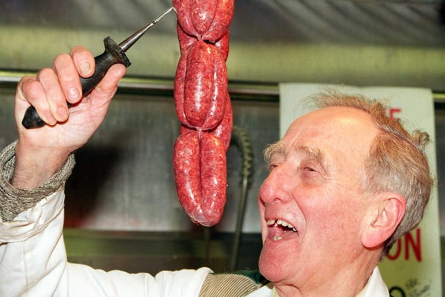 Doncaster market trader Norman Rouse with one of his  specialities: Venison sausages in 1999