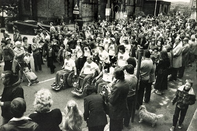 Mick Kelly, Terry Willett and Derek Curson are welcomed home warmly after their epic week long London to Stocksbridge wheelchair marathon in aid of the British Paraplegic Society which was started by Prince Charles at Buckingham Palace, May 27, 1979