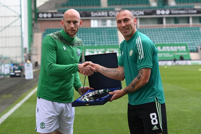 Hibs’ David Gray presents Scott Brown with a gift before the midfielder’s final game as a Celtic player at Easter Road.