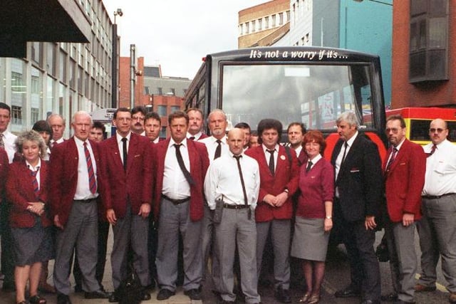 Bus drivers get together in 1997 to take a minutes silence.