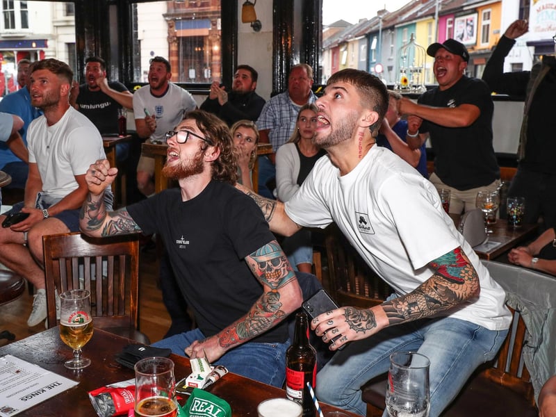 England fans watch England beat Germany 2-0 in the Euros 2020. Fans pictured in The Kings pub celebrating as England score their first goal. Picture: Stuart Martin (220421-7042)