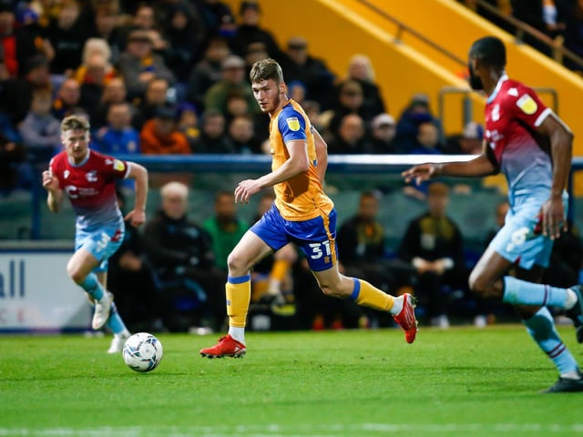 Mansfield Town forward James Gale looks for a free man.