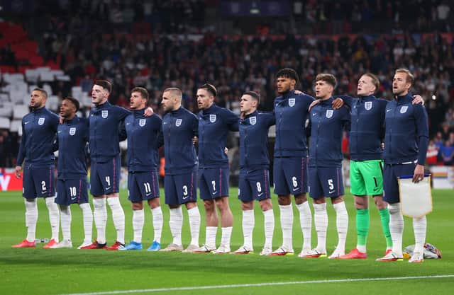 LONDON, ENGLAND - OCTOBER 12: Players of England line up for the national anthem prior to the 2022 FIFA World Cup Qualifier match between England and Hungary at Wembley Stadium on October 12, 2021 in London, England. (Photo by Julian Finney/Getty Images)
