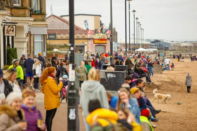 Crowds flock to Porty beach as rules change from 'stay at home' to 'stay local' for Easter weekend picture: Scott Louden