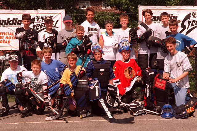 Handsworth Grange Comp school, where  Sheff South Yorks Police, Franklin Street Hockey, Sheffield Steelers, and the British Skater Hockey Assn launched their five-week summer street hockey coaching program in 1997. Seen is Steelers player Andre Malo , Pc Jean Payling, and Joe Wildish BSHA Coach with some of the young players