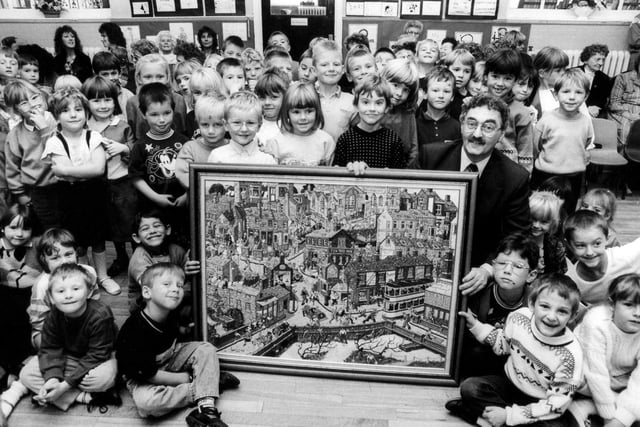 Artist Joe Scarborough pictured with young pupils at Malin Bridge Infants School, Sheffield, after unveiling his latest picture, October 18, 1989