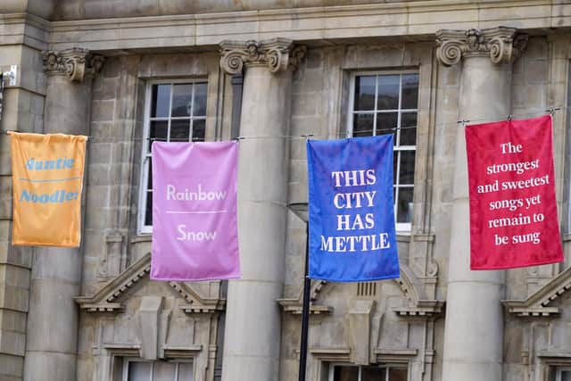 The art event has seen 36 colourful banners hung up across the square, each bearing messages of optimism and inspiration provided by a mixture of Sheffield’s famous citizens. Picture Scott Merrylees