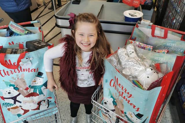 Lainie-Mae Madeley spent three hours picking out Christmas presents for other children, all of which were bought with money raised through the sales of her Christmas cards