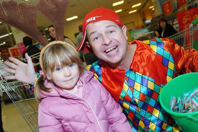 Four year old Darcy Connor from Edenthorpe at the Doncaster Asda at Christmas time in 2007. Pictured with Snow White actor Dean Winters.