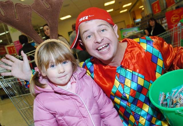 Four year old Darcy Connor from Edenthorpe at the Doncaster Asda at Christmas time in 2007. Pictured with Snow White actor Dean Winters.