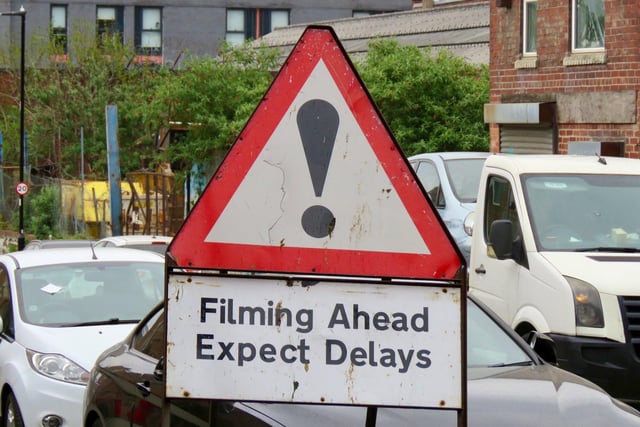 Filming in Sheffield for new HBO miniseries The Regime, starring Kate Winslet and Hugh Grant. A road sign warns drivers to expect delays during filming around an old steel cementation furnace in Shalesmoor. Photos by @steelcitysnaps via Twitter