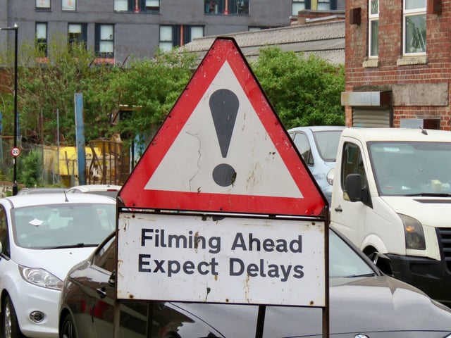 Filming in Sheffield for new HBO miniseries The Regime, starring Kate Winslet and Hugh Grant. A road sign warns drivers to expect delays during filming around an old steel cementation furnace in Shalesmoor. Photos by @steelcitysnaps via Twitter