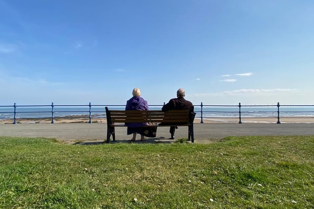 A couple take in the sea air at a much quieter than usual Seaton Carew.