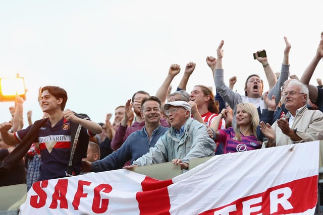 Sunderland fans celebrate their teams second goal during the Sky Bet League One match against Gillingham and Sunderland at Priestfield Stadium.
