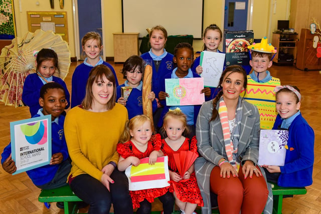Teachers Katherine Todd (left) and Kate Stephenson with pupils at St. Peter's & St. Paul's RC Primary School in Olive Street, South Shields. They were celebrating in 2018 after winning an international award, for their work with other schools around the globe, including China.