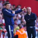 Sheffield United manager Paul Heckingbottom (left) encourages his players as Nottingham Forest manager Steve Cooper looks on: Martin Rickett/PA Wire.