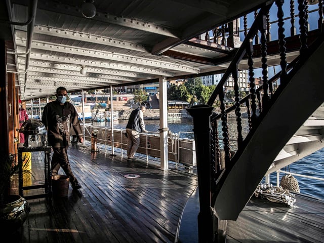 Swabbing the deck of the Nile steam ship "PS Sudan"