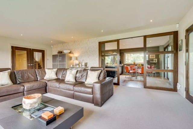 The large living room benefits from large picture bay windows providing not only hoards of natural life but also fabulous views of Lake Windermere.