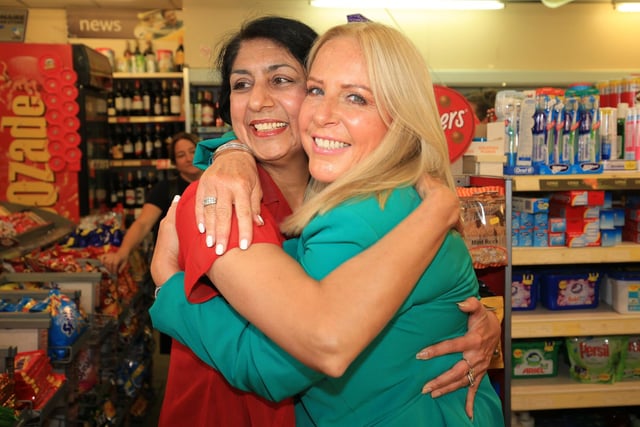 National Lottery winner Deana Sampson, who scooped £5.4m on the Lotto in 1996, returning to Stradbroke Post Office, Sheffield where she bought her winning ticket. She is pictured with postmistress Balwinder Dhillon, who sold her the ticket, in June 2018 when she unveiled a new gold lottery playing point, complete with her lucky hand print for other lottery players to rub