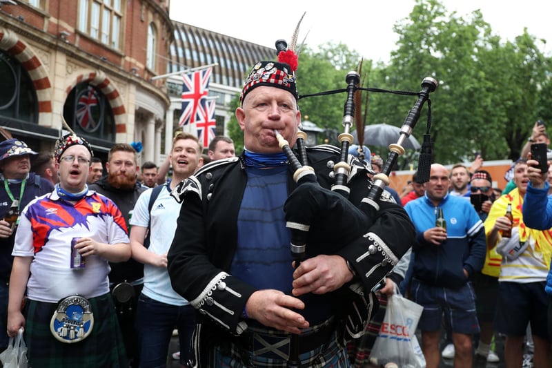 A bagpipe player as Scotland fans gather in Leicester Square before the UEFA Euro 2020 match between England and Scotland later tonight (Photo: Kieran Cleeves/PA Wire).