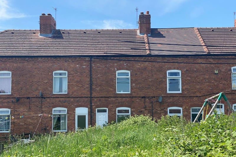 The vacant, freehold, mid-terrace property stands back from the road behind a foregarden. It features two reception rooms, a kitchen and toilet on the ground floor and two bedrooms and a bathroom on the first floor, as well as an attic bedroom.