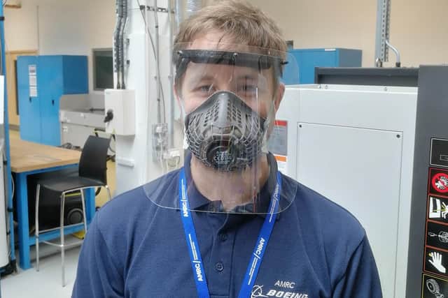 Daniel Tomlinson, Project Engineer at the AMRC Design and Prototyping Group, wearing one of the finished face visors.