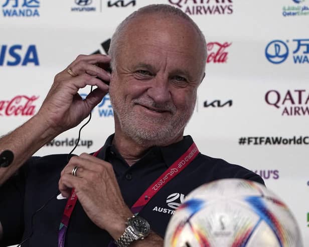 Australia's head coach Graham Arnold adjusts his headphone during a press conference on the eve of the Group D World Cup match between France and Australia, in Doha, Qatar: AP Photo/Ariel Schalit