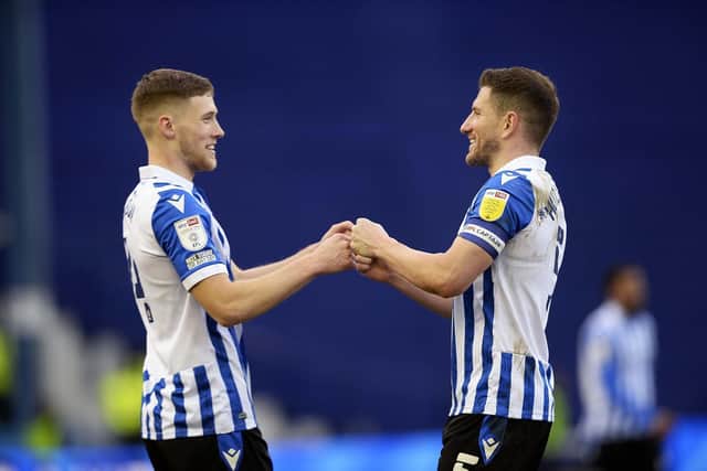 Departed pair Lewis Gibson and Sam Hutchinson share happier times at Sheffield Wednesday.