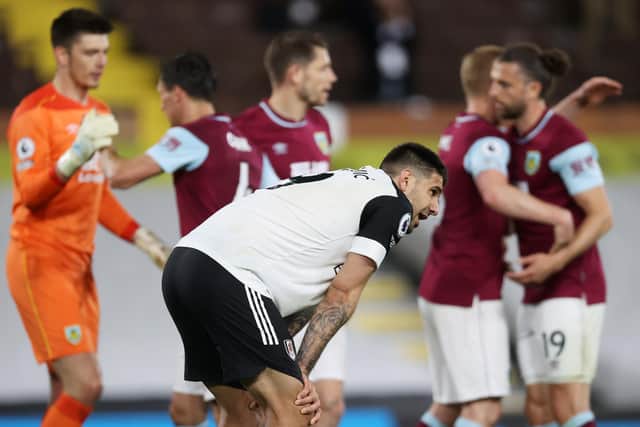 Aleksandar Mitrovic of Fulham looks dejected after defeat as Fulham are relegated following the Premier League match between Fulham and Burnley at Craven Cottage: Clive Rose/Getty Images