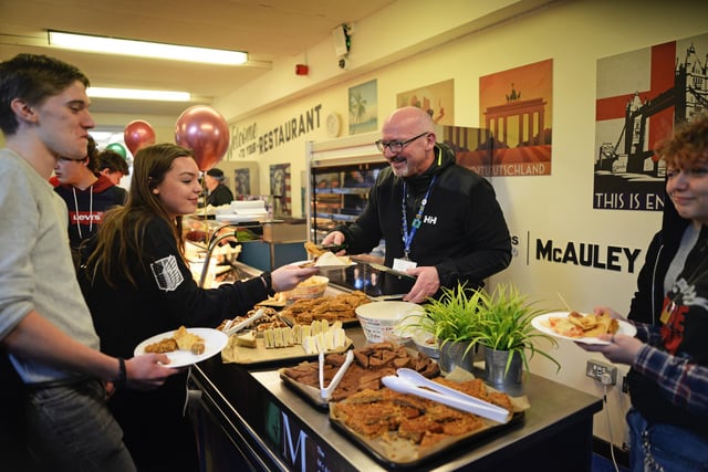 John Rooney, Headteacher, pictured serving pupils during their surprise leavers party. Picture: NDFP-20-03-20 McAuleyLeaversParty 1-NMSY